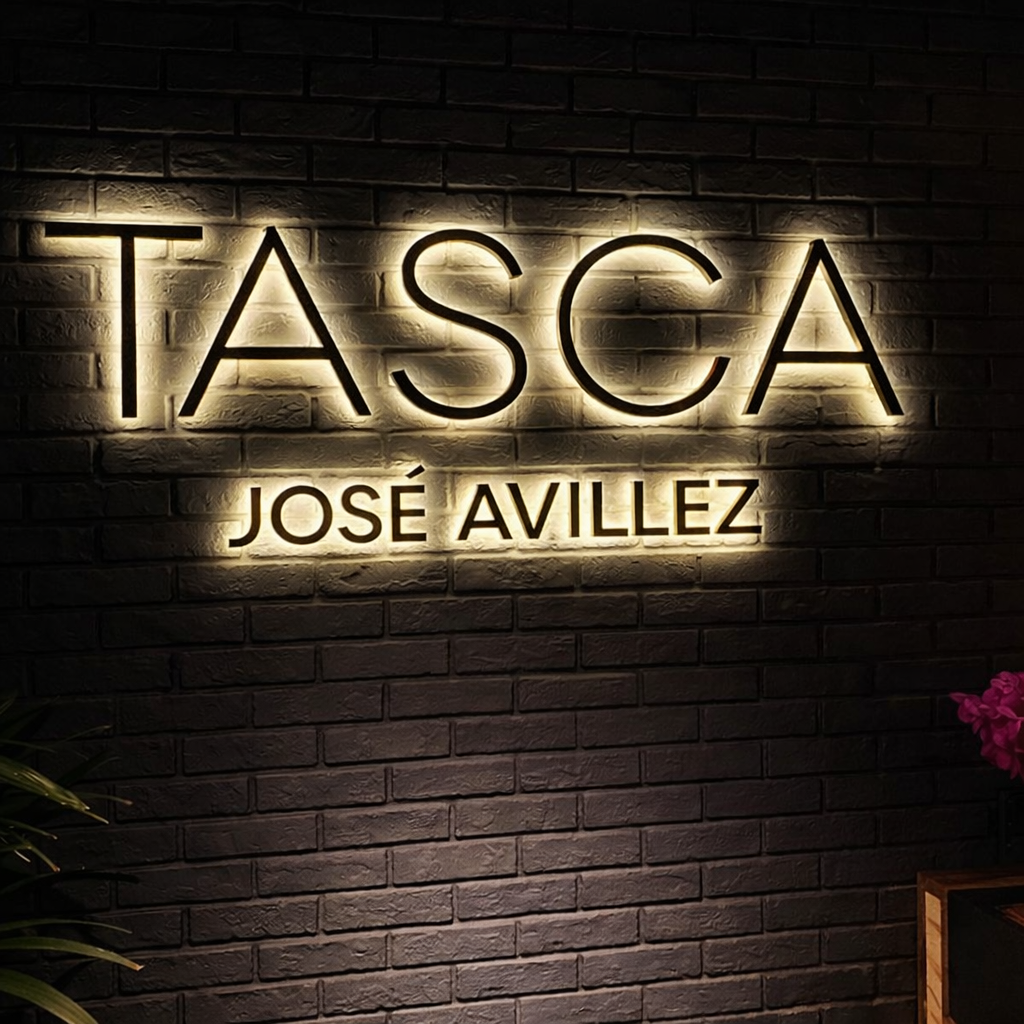 Neon quote sign above a warm cafe lounge seating area