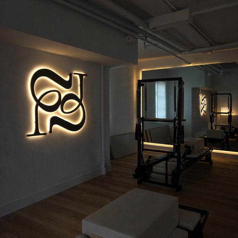 Motivational neon wall statement in a wellness training room
