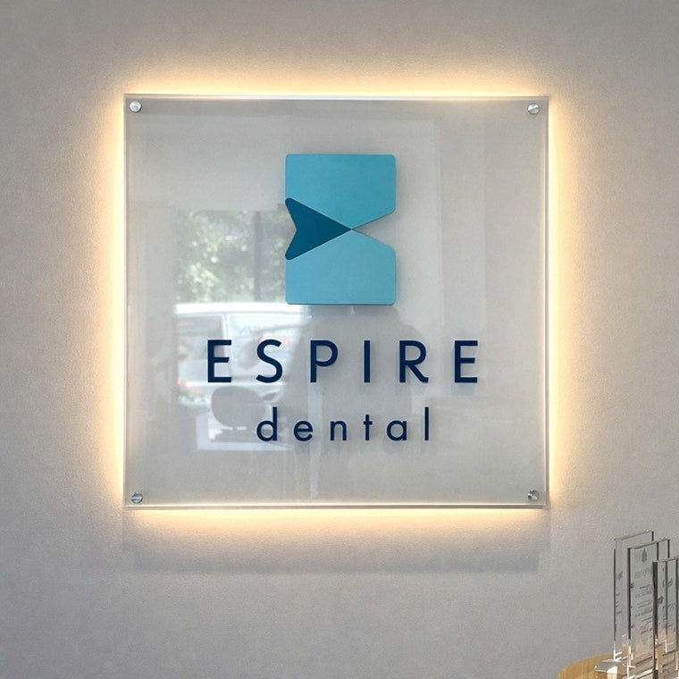 Reception desk with illuminated corporate brand lettering
