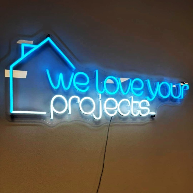 Illuminated monument sign at a residential entrance