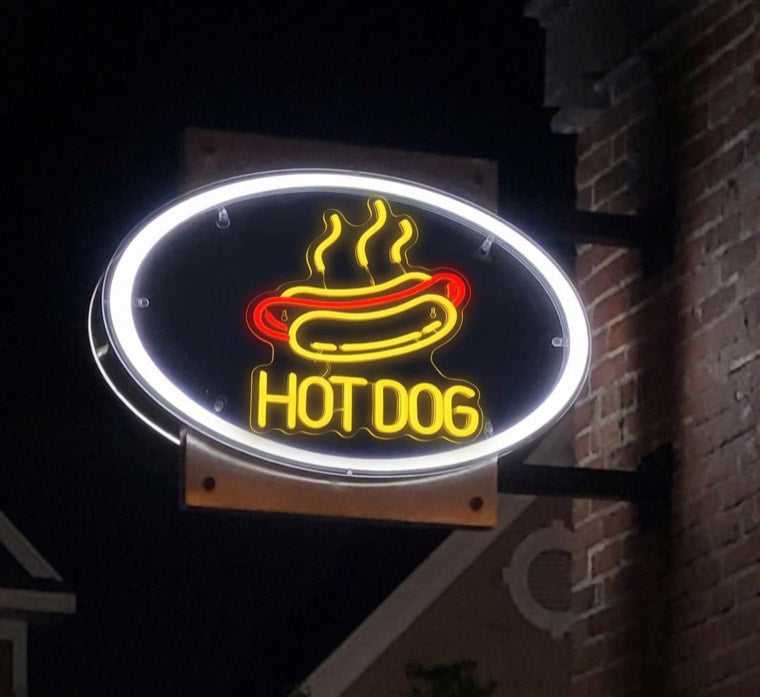 Custom illuminated restaurant wall sign in a dining room