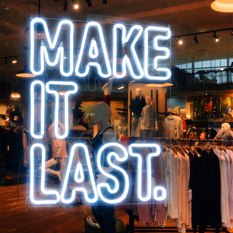 Happy Shop neon window display for a retail storefront
