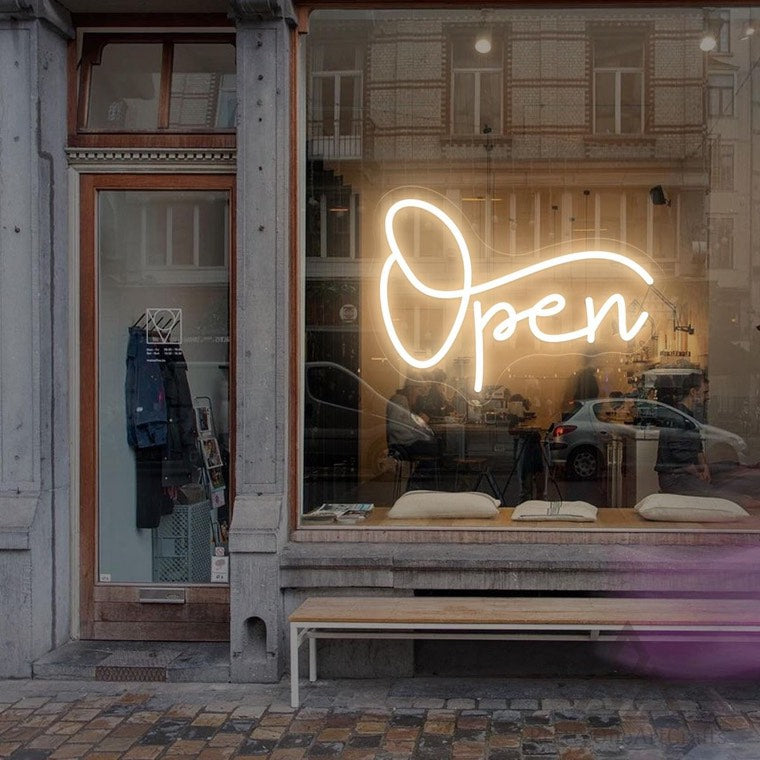 Salt Boutique round projecting sign on a retail exterior