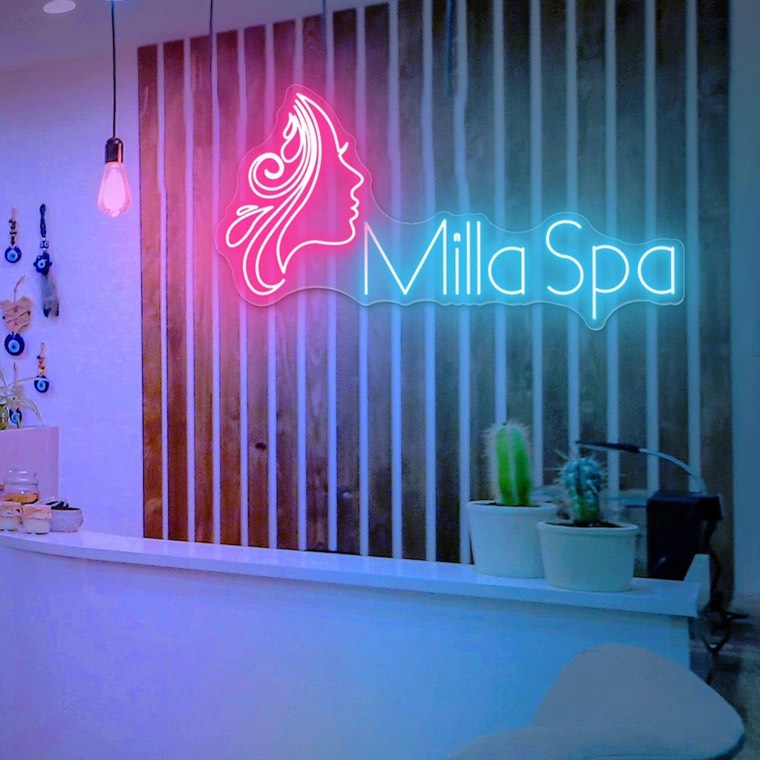 Wellness studio exterior sign at dusk