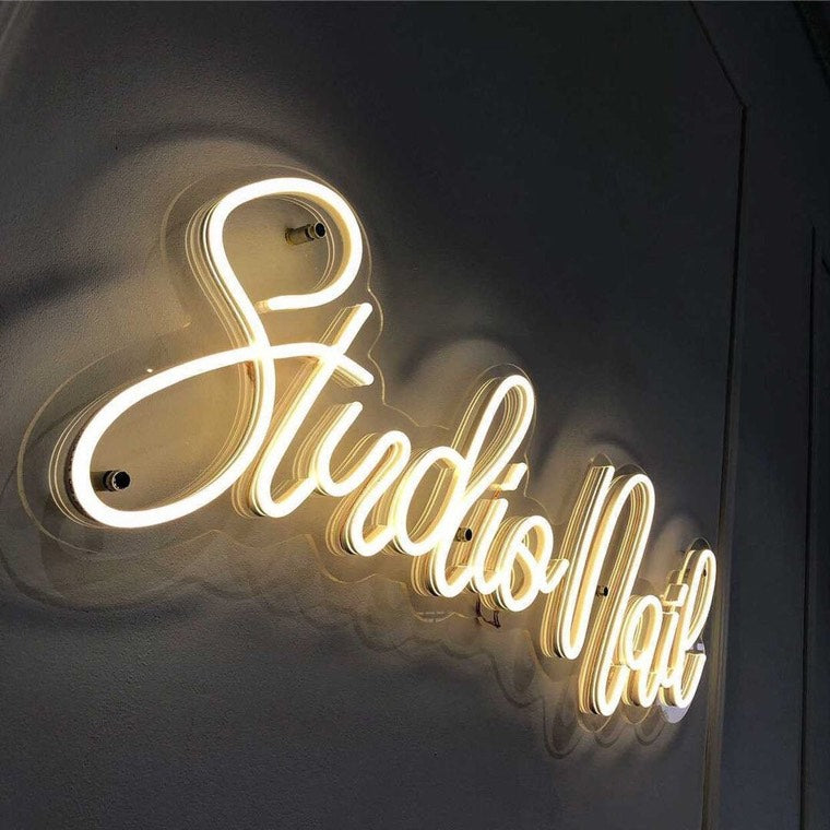 Pastel neon statement sign in a beauty and wellness corner